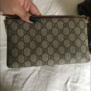 gucci supreme wristlet